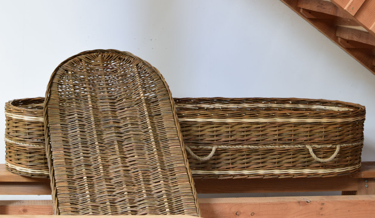 Brown willow coffin with white accents