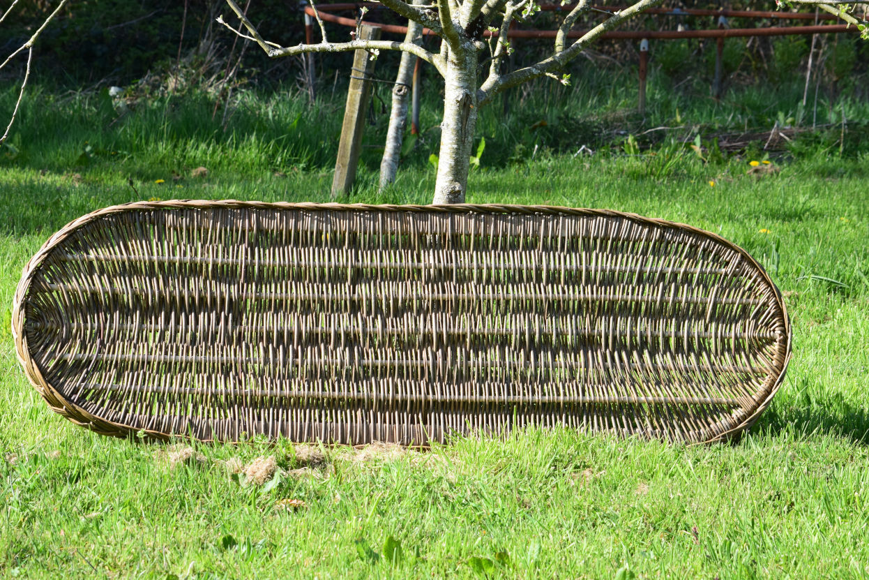 Willow coffin with woven base