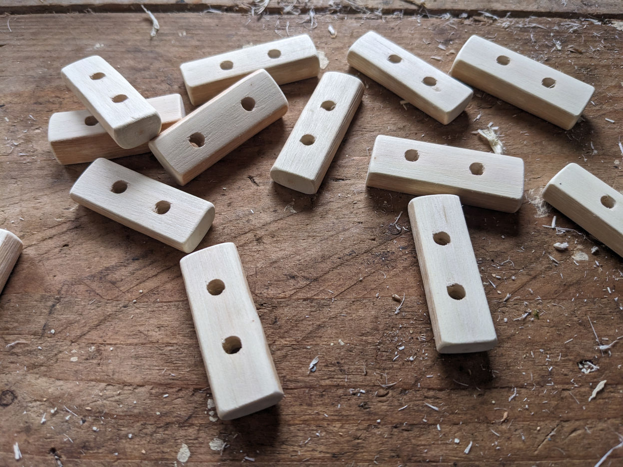 Hazel toggles being made by hand